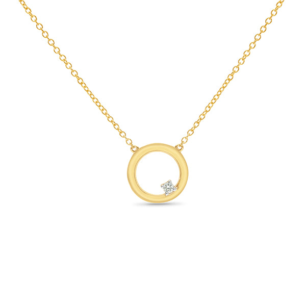 Circle pendant featuring a single claw set diamond.